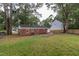 An exterior view of the back of the home with backyard at 3429 Dogwood Dr, Raleigh, NC 27604