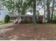 Charming brick ranch with covered parking and front yard at 3429 Dogwood Dr, Raleigh, NC 27604