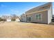 Large backyard features a patio with grassy area, perfect for outdoor living and entertaining at 345 Springtime Fields Ln, Wake Forest, NC 27587