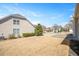 Expansive backyard with a level lawn, offering endless possibilities for outdoor enjoyment at 345 Springtime Fields Ln, Wake Forest, NC 27587