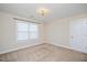 Bedroom featuring carpet, a window and a chandelier, perfect for relaxing at 345 Springtime Fields Ln, Wake Forest, NC 27587