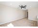 Neutral bonus room offering soft carpet, recessed lighting, and a ceiling fan, adaptable to many needs at 345 Springtime Fields Ln, Wake Forest, NC 27587
