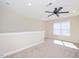 Bright bonus room featuring a ceiling fan and window for natural light, ideal for recreation or relaxation at 345 Springtime Fields Ln, Wake Forest, NC 27587