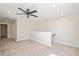 Spacious bonus room featuring plush carpet, neutral walls, and modern ceiling fan, perfect for versatile living at 345 Springtime Fields Ln, Wake Forest, NC 27587