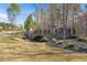 Charming community bridge over a small creek and landscaped with greenery and a walking path at 345 Springtime Fields Ln, Wake Forest, NC 27587