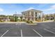Community building with parking lot, landscaping and a playground in the background at 345 Springtime Fields Ln, Wake Forest, NC 27587