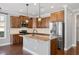 Well-equipped kitchen with a granite island, stainless steel appliances, and lots of storage at 345 Springtime Fields Ln, Wake Forest, NC 27587