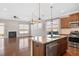 Open-concept kitchen featuring stainless steel appliances, granite countertops, and an island at 345 Springtime Fields Ln, Wake Forest, NC 27587