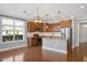 Stylish kitchen featuring custom cabinets, stainless appliances, granite counters, and hardwood floors at 345 Springtime Fields Ln, Wake Forest, NC 27587