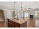 Modern kitchen with a large island, stainless steel appliances, and an open floor plan at 345 Springtime Fields Ln, Wake Forest, NC 27587