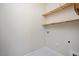 Laundry room showing built-in shelves and washer and dryer hookups at 345 Springtime Fields Ln, Wake Forest, NC 27587