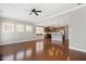 Spacious living room with hardwood floors, natural light, and an open kitchen layout at 345 Springtime Fields Ln, Wake Forest, NC 27587