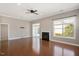 Bright living room with fireplace, hardwood floors, and natural light at 345 Springtime Fields Ln, Wake Forest, NC 27587