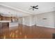 Open-concept living room featuring hardwood floors and a ceiling fan at 345 Springtime Fields Ln, Wake Forest, NC 27587