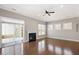 Light-filled living room with hardwood floors and a cozy fireplace at 345 Springtime Fields Ln, Wake Forest, NC 27587