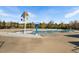 Community pool features a mushroom-shaped fountain and colorful splash umbrella for Gathering fun at 345 Springtime Fields Ln, Wake Forest, NC 27587