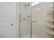 Clean and modern tile shower with glass door and chrome fixtures at 345 Springtime Fields Ln, Wake Forest, NC 27587