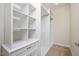 Spacious walk-in closet with custom shelves and drawer unit at 345 Springtime Fields Ln, Wake Forest, NC 27587
