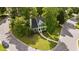 Aerial view of a green home with mature trees and green lawn at 3624 Singleleaf Ln, Raleigh, NC 27616