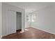Cozy bedroom features natural light and wood look floors, plus a closet at 3624 Singleleaf Ln, Raleigh, NC 27616