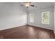 Bedroom features a ceiling fan and lots of natural light from two windows at 3624 Singleleaf Ln, Raleigh, NC 27616