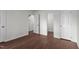 Spacious bedroom with ample natural light, neutral paint, and wood look flooring at 3624 Singleleaf Ln, Raleigh, NC 27616
