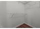Walk-in closet with white wire shelving and wood look flooring at 3624 Singleleaf Ln, Raleigh, NC 27616