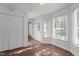 Inviting entryway with hardwood floors, natural light, and a view of adjacent rooms at 3624 Singleleaf Ln, Raleigh, NC 27616