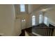 Bright foyer with abundant natural light, hardwood floors, and staircase with white railing at 3624 Singleleaf Ln, Raleigh, NC 27616