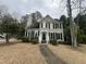 Charming two-story home featuring black shutters, a chimney, and a walkway leading to the front door at 3624 Singleleaf Ln, Raleigh, NC 27616