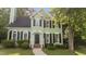 Charming two-story home with green siding, black shutters, and a well-manicured front yard at 3624 Singleleaf Ln, Raleigh, NC 27616