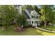 Charming two-story home with green siding, black shutters, and a well-manicured front yard at 3624 Singleleaf Ln, Raleigh, NC 27616
