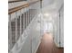 Hallway with hardwood floors and carpeted stairs leading to upper level at 3624 Singleleaf Ln, Raleigh, NC 27616