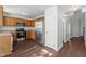 Well-equipped kitchen with stainless steel appliances, wooden cabinetry, and hardwood flooring at 3624 Singleleaf Ln, Raleigh, NC 27616