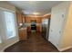 Well-lit kitchen boasting stainless steel appliances, light-colored cabinets, and vinyl flooring at 3624 Singleleaf Ln, Raleigh, NC 27616