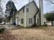 View of the back of the house with an air conditioning unit, and a view of the driveway and garage at 3624 Singleleaf Ln, Raleigh, NC 27616