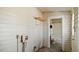 Small room with a vintage bathroom inside and a doorway to a bathtub and window at 404 Cherry St, Oxford, NC 27565