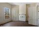 Bright living room with large windows, light walls, hardwood floors, and classic interior doors at 404 Cherry St, Oxford, NC 27565