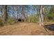 An outdoor shed nestled among trees with lots of space at 404 Cherry St, Oxford, NC 27565