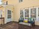 Back porch featuring outdoor seating and decor, creating a cozy and inviting outdoor living area at 4617 Atterbury Ct, Raleigh, NC 27604