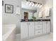 Bright bathroom featuring double vanity, modern lighting, and large mirror, with fresh towels at 4617 Atterbury Ct, Raleigh, NC 27604