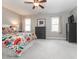 Bright bedroom with ceiling fan, neutral paint, and colorful bedding at 4617 Atterbury Ct, Raleigh, NC 27604
