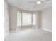 Bedroom featuring neutral paint, carpet and bright bay windows at 4617 Atterbury Ct, Raleigh, NC 27604
