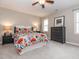 Relaxing bedroom with ceiling fan, neutral paint, and colorful bedding at 4617 Atterbury Ct, Raleigh, NC 27604
