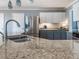 Elegant kitchen featuring granite countertops, stainless steel appliances, and stylish lighting fixtures, perfect for culinary enthusiasts at 4617 Atterbury Ct, Raleigh, NC 27604