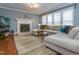 Relaxing living room with a fireplace, large sectional, and a cozy atmosphere at 4617 Atterbury Ct, Raleigh, NC 27604