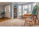 Bright living room area with large windows, light walls and wood floors at 4617 Atterbury Ct, Raleigh, NC 27604