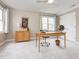 Office features neutral paint, carpet, multiple windows and wood furniture at 4617 Atterbury Ct, Raleigh, NC 27604
