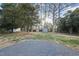 Spacious backyard featuring a shed and plenty of trees at 4708 Sweetbriar Dr, Raleigh, NC 27609