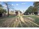 Wide view of backyard showing the exterior with covered patio at 4708 Sweetbriar Dr, Raleigh, NC 27609